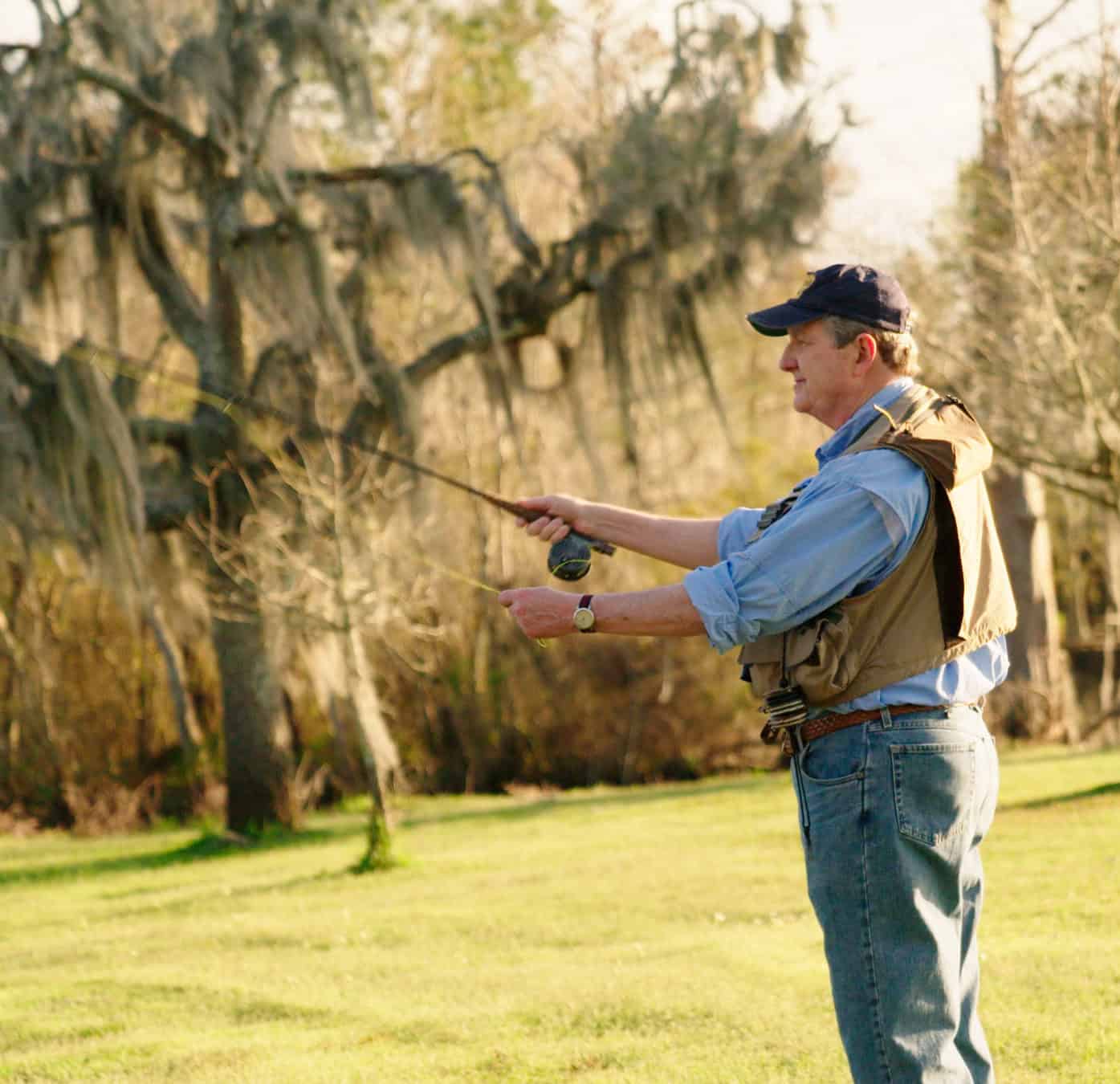 Man fishing outdoors, promoting John Kennedy for Senate.